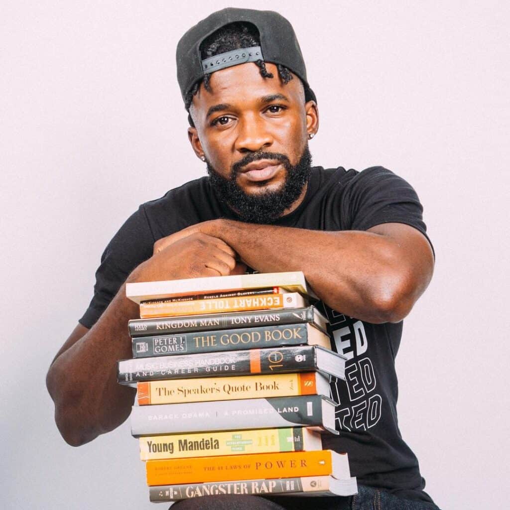 Da Fixx Ep 240 alt pic 2 Corey Paul with books (faith)