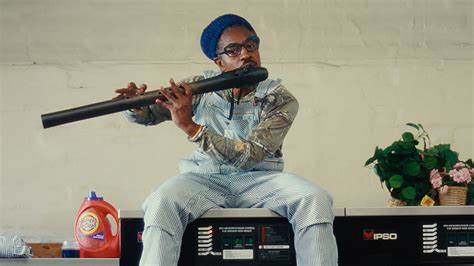 COTB 12032023 alt pic 2 andre 3000 playing flute - church