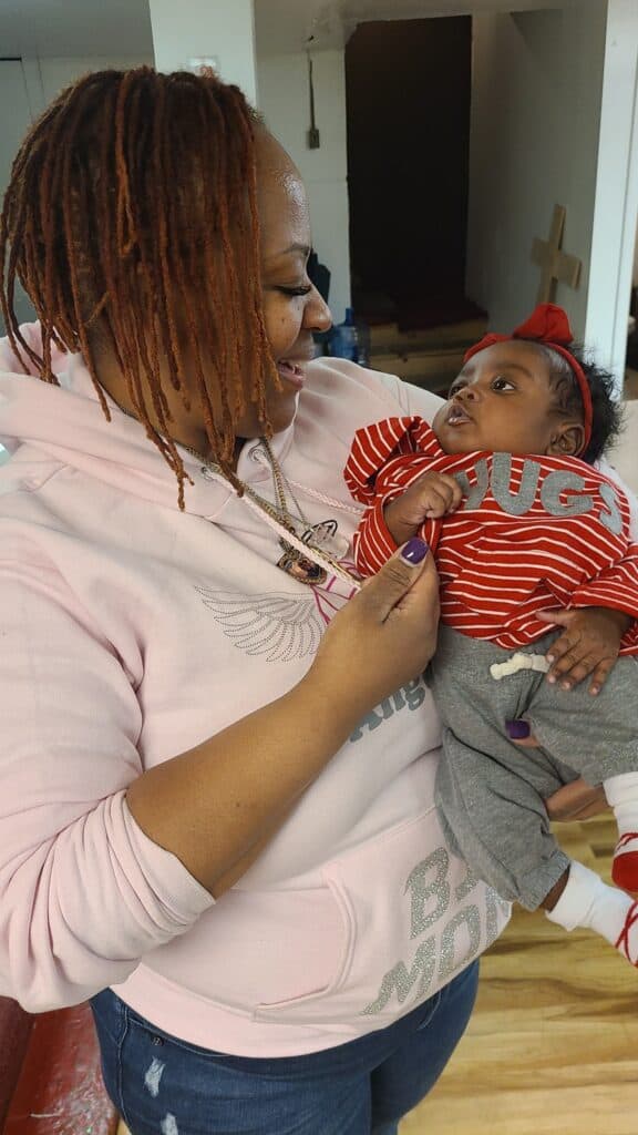 Dr. Carniki holding baby